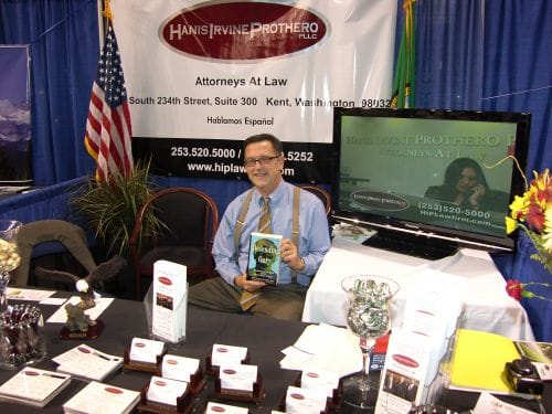 photo of attorney Mark Prothero at a booth for Hans Irvine Prothero PLLC
